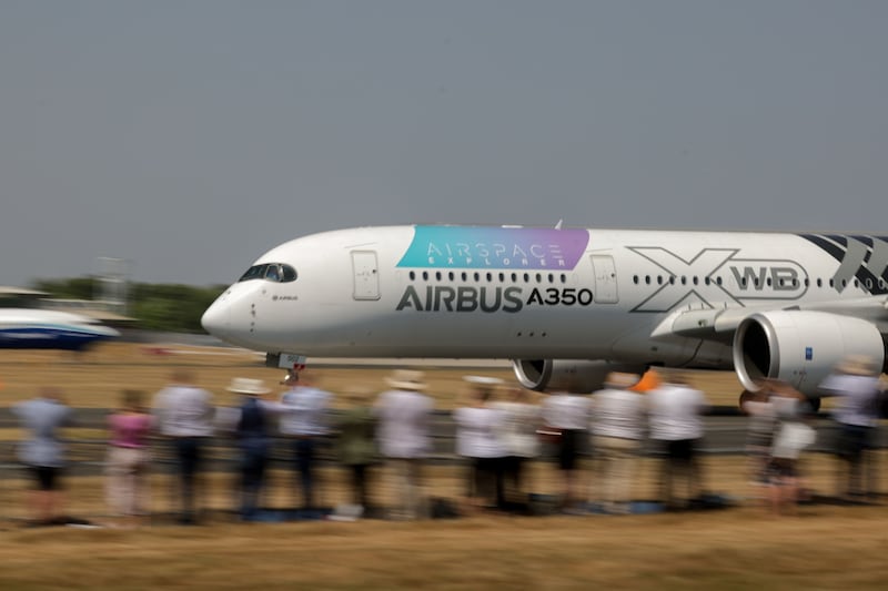 An Airbus SE A350 aircraft lands after an aerial display. Bloomberg