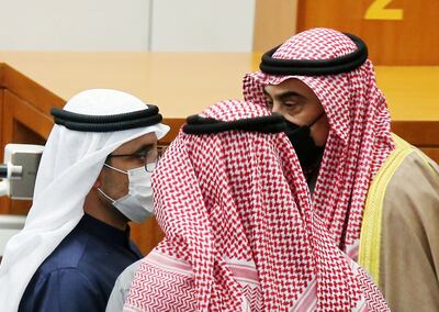 Sheikh Sabah Al Khaled Al Sabah, right, the Kuwaiti Prime Minister, speaks to Sheikh Ahmad Nasser Al Mohammed Al Sabah, the Foreign Minister, at the national Parliament. AFP