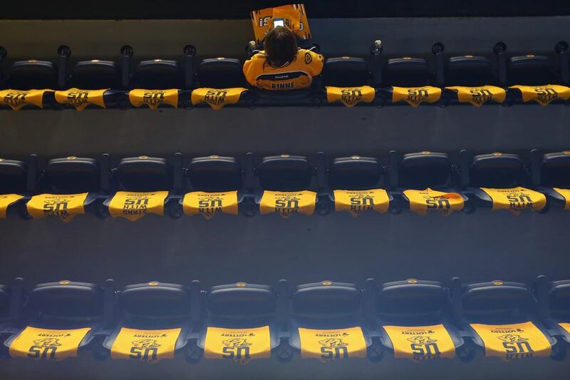A Nashville Predators fan sits in his seat before Game Six of NHL’s Western Conference final. Aaron Doster / USA TODAY