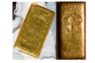 This image provided by the US Attorney's Office shows two of the gold bars allegedly found during a search by federal agents. AP