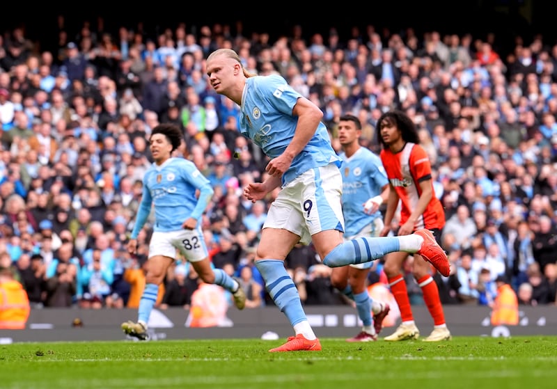 Manchester City's Erling Haaland celebrates after scoring their third goal. PA 