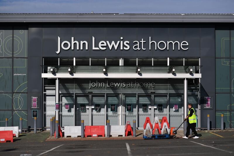 Signs on a John Lewis store inform customers of its temporary closure in Tunbridge Wells. AFP