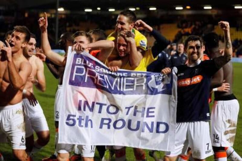 Luton Town players celebrate their shock FA Cup fourth round win at Noriwch City.