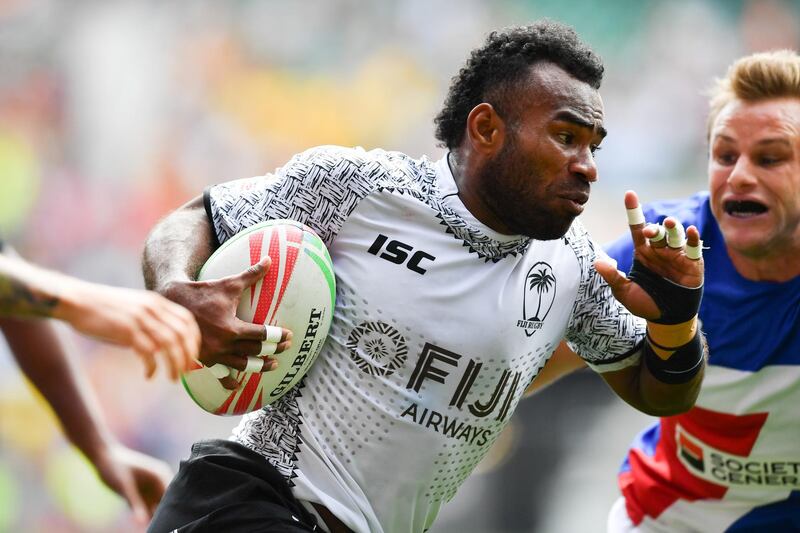 Fiji's Jerry Tuwai runs with the ball on his way to scoring a try during the rugby union sevens pool match between France and Fiji on the first day of the London 2019 World Rugby Sevens Series event at Twickenham Stadium in west London on May 25, 2019. (Photo by Ben STANSALL / AFP)