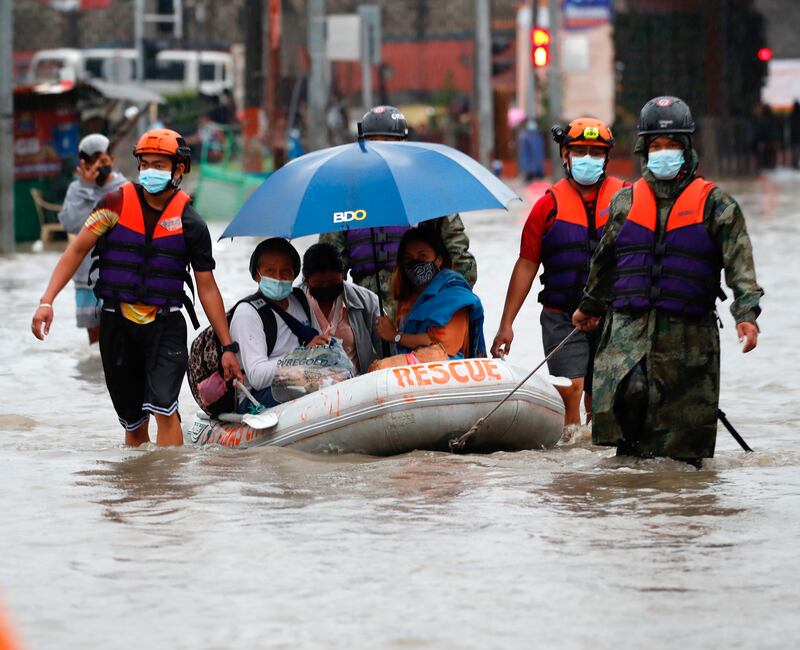 Authorities have moved more than 14,000 people to safety after their communities were flooded by heavy monsoon rain and a tropical storm.