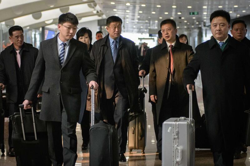 (FILES) This file photo taken on February 19, 2019 shows a man believed to be North Korean negotiator Kim Hyok Chol (centre L-blue tie) after arriving on an Air Koryo flight from Pyongyang, at Beijing international airport. North Korea executed its special envoy to the United States, Kim Hyok Chol, following the collapse of the second summit between leader Kim Jong Un and President Donald Trump, a South Korean newspaper reported on May 31, 2019. / AFP / Ed JONES
