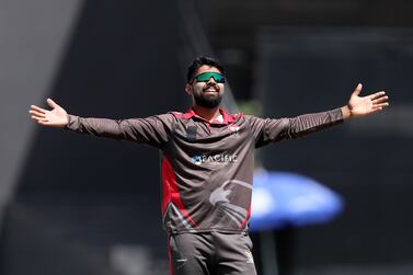 UAE's Basil Hameed takes the wicket of PNG's Hiri Hiri. The UAE take on Papua New Guinea in an ODI in the ICC Men's Cricket World Cup League 2. Sharjah Cricket Stadium. Chris Whiteoak / The National