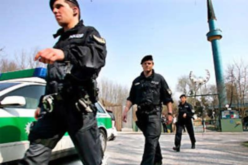 Police officers leave the Islamic Centre in Munich, in April 2005, after searching for evidence of terrorist activity.