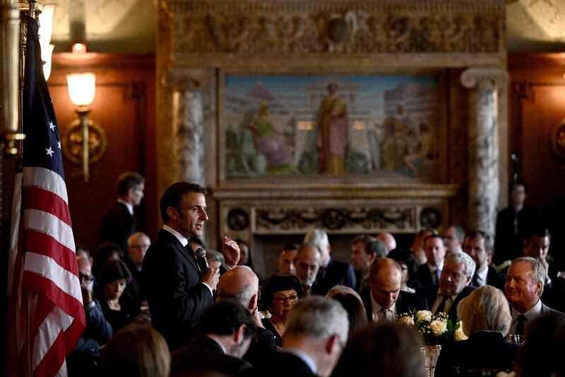 Mr Macron speaks during a working lunch on climate and biodiversity issues with US Climate Envoy John Kerry, members of Congress and key US stakeholders on climate at the Library of Congress in Washington. AFP