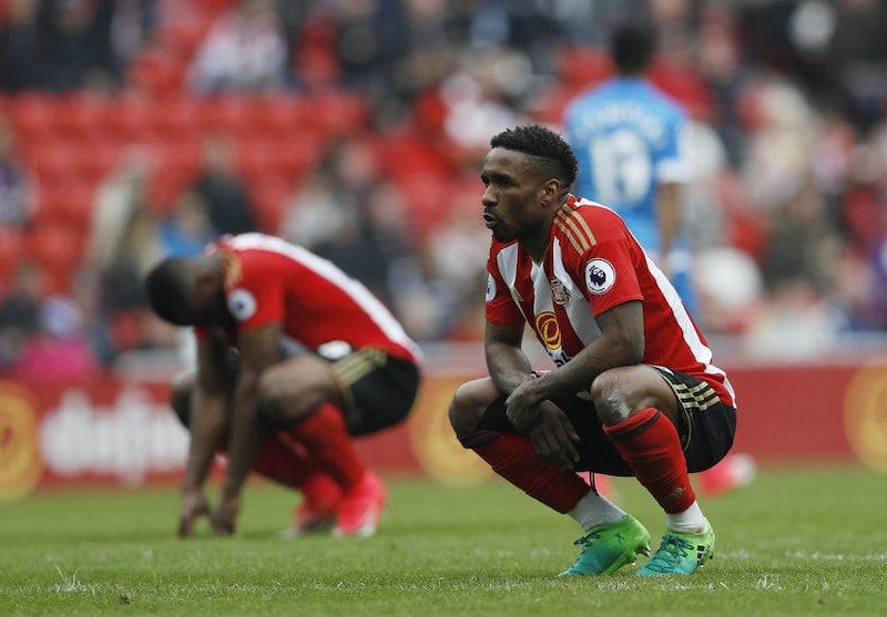 Jermain Defoe, right, and Victor Anichebe after Sunderland's relegation from the Premier League was confirmed. Lee Smith / Reuters