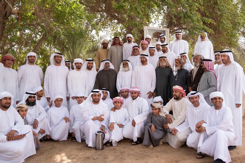 AL AIN, UNITED ARAB EMIRATES - January 19, 2019: HH Sheikh Mohamed bin Zayed Al Nahyan, Crown Prince of Abu Dhabi and Deputy Supreme Commander of the UAE Armed Forces (2nd row 6th R) stands for a photograph during a visit to Oud Al Raha in Um Ghaffa. Seen with HH Major General Sheikh Khaled bin Mohamed bin Zayed Al Nahyan, Deputy National Security Adviser (back 2nd R), HH Sheikh Khalifa bin Tahnoon bin Mohamed Al Nahyan, Director of the Martyrs' Families' Affairs Office of the Abu Dhabi Crown Prince Court (back 3rd R) and Hamad Rashid Mohamed Al Neyadi (2nd row 5th R).

( Mohamed Al Hammadi / Ministry of Presidential Affairs )
---