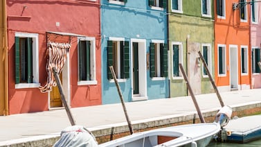 Burano is a magnet for day-trippers with its tiny waterways and multicoloured houses. Photo: Mattia Mionetto