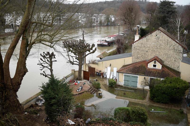 Foodwater from the Seine river in the backyard of a house in Bougival, west of Paris. Stephane De Sakutin / AFP