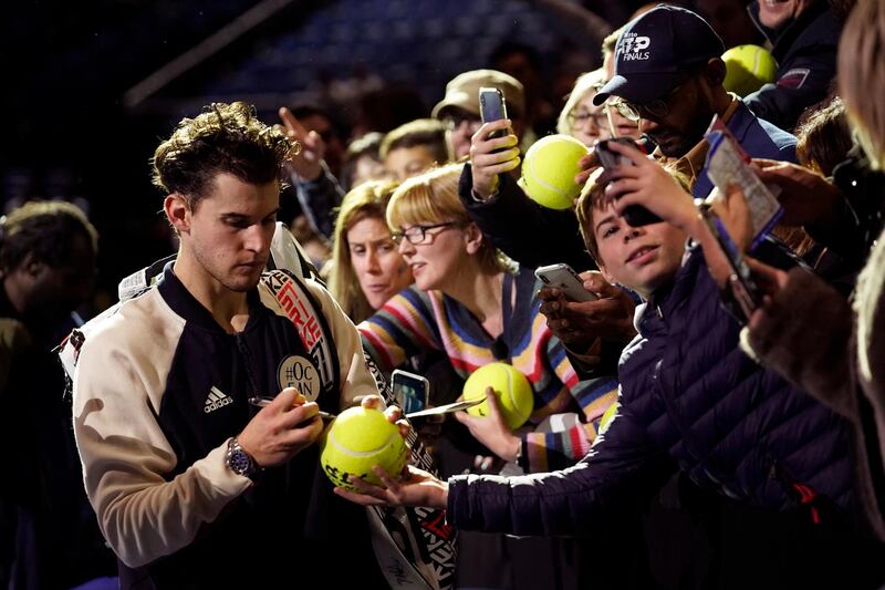 Thiem signs autographs after winning his semi final, and he takes on Greek 21-year-old Stefanos Tsitsipas in the final on Sunday. EPA