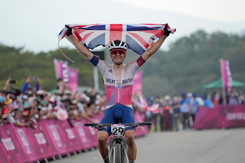 Tom Pidcock of Great Britain celebrates as he wins the gold medal during the men's cross country mountain bike competition at the 2020 Summer Olympics.