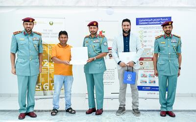 Mohammed Rahmatullah and Adel Abdul Hafeez are honoured at a reception hosted by Sharjah Police, attended by Maj Gen Saif Al Shamsi, commander-in-chief of Sharjah Police, centre. Image: Sharjah Police
