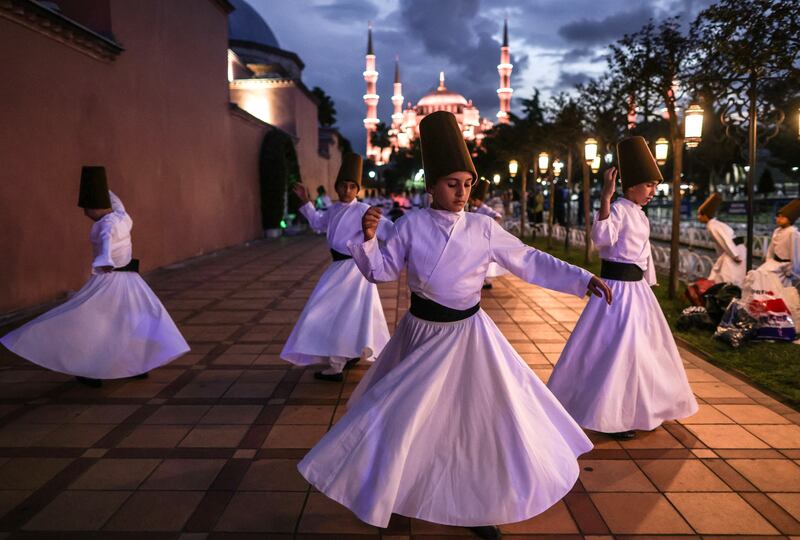 Whirling dervish children practise for a performance at Blue Mosque Square, Istanbul. EPA