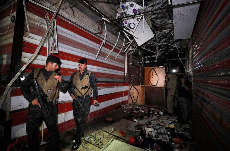 Iraqis inspect the site of the explosion in a popular market in the mostly Shiite neighbourhood of Sadr City, Baghdad.