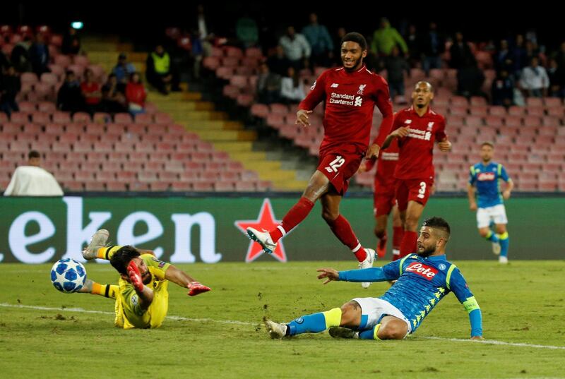 Napoli's Lorenzo Insigne slides in to score the winning goal. Reuters