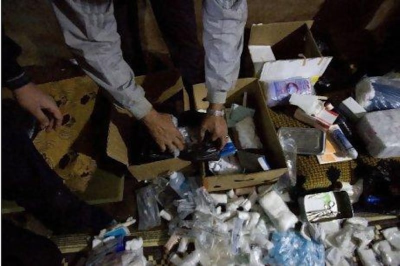 Volunteers sort through medical supplies at one of Syria's secret hospitals.