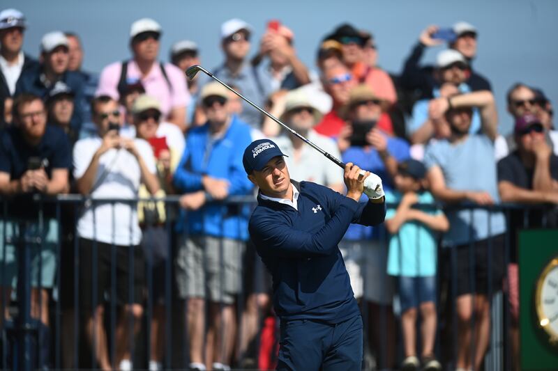 Jordan Spieth hits his tee shot on the third hole on his way to an opening round 65.