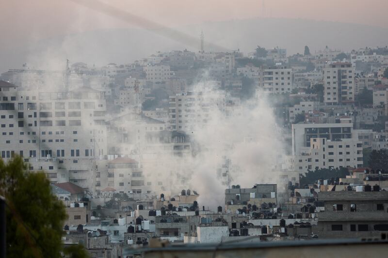 Smoke rises over Jenin during Monday's Israeli military operation. Reuters