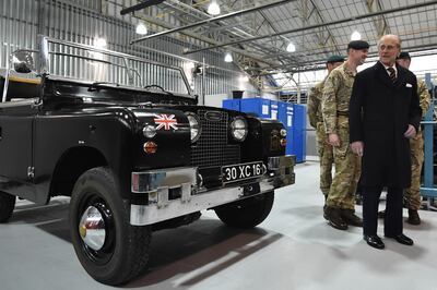 LYNEHAM, ENGLAND - MARCH 11: Prince Philip, Duke of Edinburgh (R), Colonel-in-Chief, Royal Electrical and Mechanical Engineers (REME), looks at a Black 1960s ceremonial Land Rover Series 2A Escort Rover formally owned by the Queen Elizabeth The Queen Mother, during a visit the new home of REME to be named "The Prince Philip Barracks" at MOD Lyneham on March 11, 2016 in Lyneham, England.
Prince Philip toured the barracks visiting the technical training building to view the facility and meet soldiers and went on to visit one of the refurbished hangars on the former RAF site.(Photo by Ben Stanshall-WPA Pool/Getty Images)