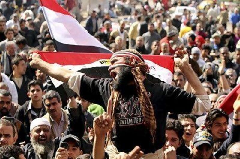 Egyptians take part in a protest demanding the army hand power to civilians in Cairo's Tahrir Square last week. Suhaib Salem / Reuters