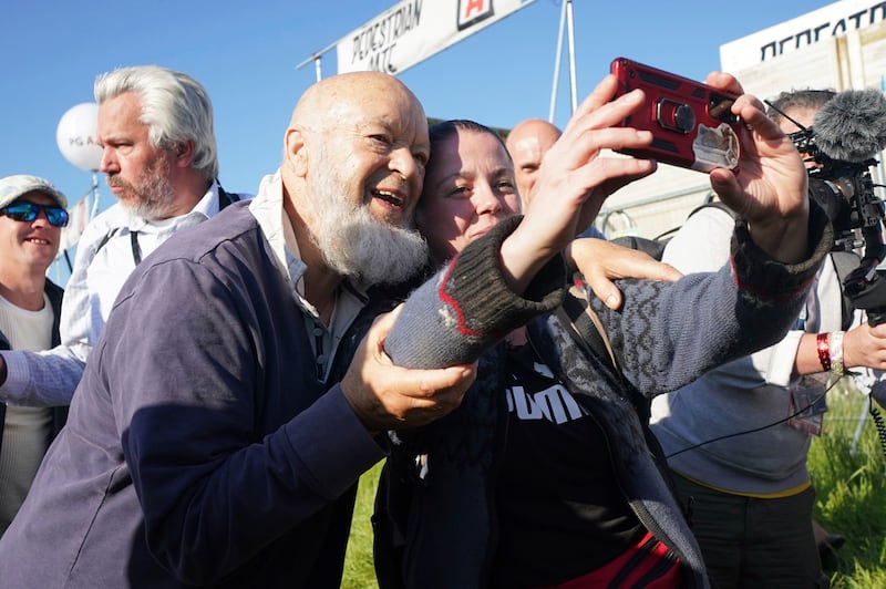Michael Eavis, Glastonbury Festival's founder, join fans on the opening day of the event in June 2022, the first since the pandemic began. AP