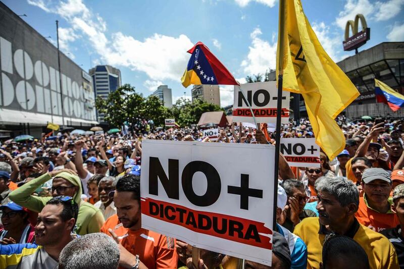 The Venezuelan legislature’s refusal to approve oil joint ventures was a political flashpoint last week when the country’s supreme court move to seize power from it, a sign of how important oil is to the country’s flailing economy. Ensuing protests led the court to reverse its decision. The protesters’ signs above read ‘no to dictatorship’. Juan Barreto / AFP