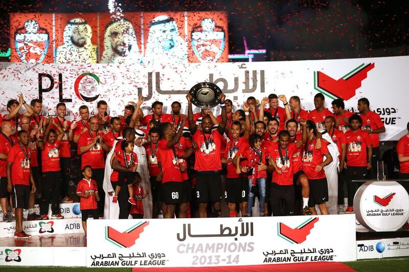Al Ahli lift the Arabian Gulf League trophy after their win over Al Dhafra at the Rashid Stadium on Sunday. Warren Little / Getty Images 