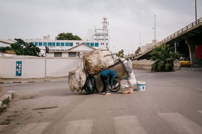 Trash pickers, or barbecha, are the country's primary engine for recycling consumer-level plastic, as no household recycling program exists. Government recycling centres pay 700 millimes ($0.25) per kilo of plastic; private recycling firms pay 1.2 dinars ($0.43) per kilo.  Erin Clare Brown / The National