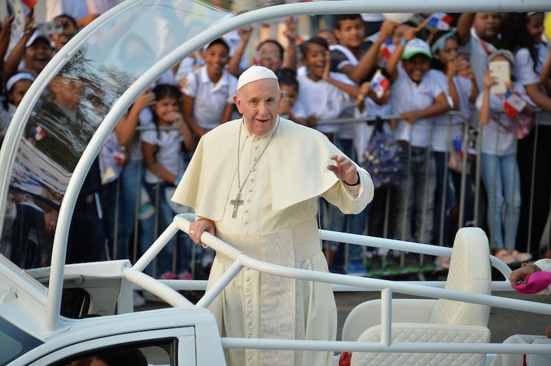 Pope Francis waves to faithfuls from the popemobile, moments after landing at Panama's Tocumen International Airport on January 23, 2019.
  Pope Francis said fear of migration was "making us crazy" as he headed to Panama on Wednesday for a gathering of young Catholics, who expect to hear him speak out strongly in defense of Central American migrants. / AFP / Marvin RECINOS
