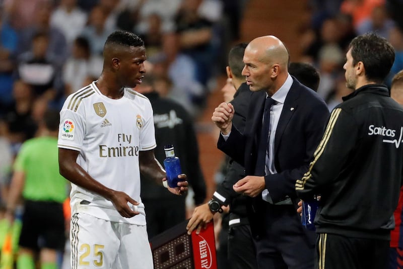 Real Madrid's coach Zinedine Zidane talks with his player Vinicius Junior. EPA