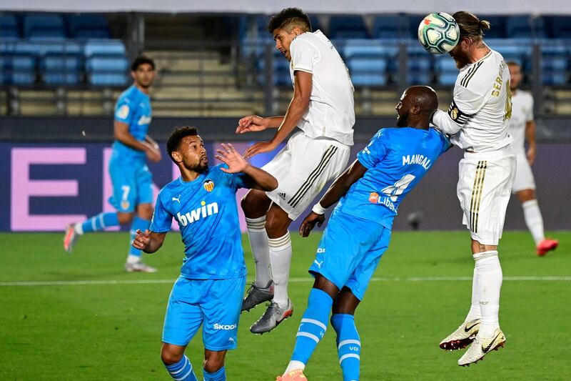 Real Madrid's Sergio Ramos vies with Valencia's Eliaquim Mangala. AFP