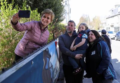 Scottish First Minister Nicola Sturgeon takes a selfie as she campaigns for the parliamentary elections in Alford, Scotland, Britain, May 5, 2021. REUTERS/Russell Cheyne/Pool