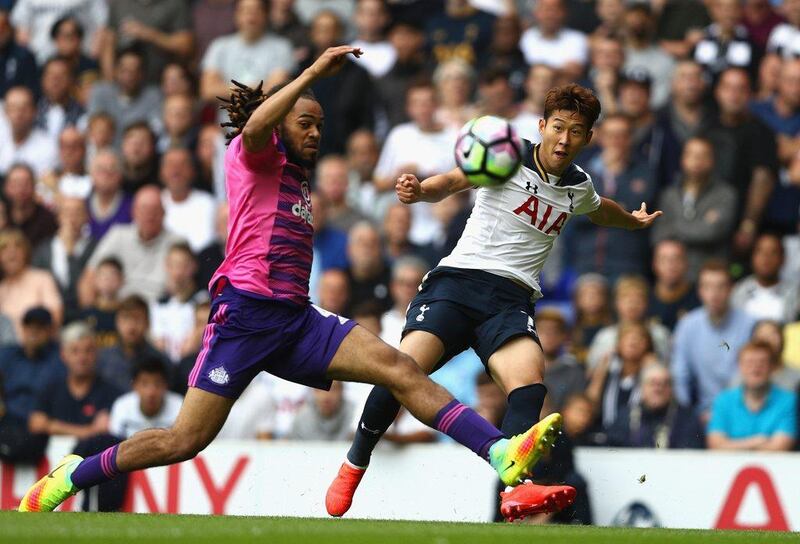 Son Heung-min of Tottenham Hotspur, right, shoots while Jason Denayer of Sunderland attempts a block. Paul Gilham / Getty Images