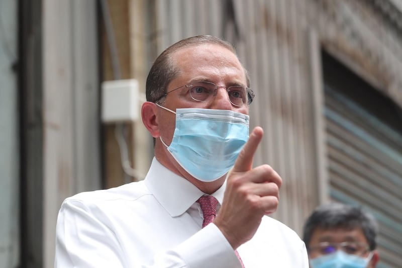 US Secretary of Health and Human Services Alex Azar gestures while visiting a mask factory in the Wugu district of New Taipei City on August 12, 2020. Azar is in Taipei for a three-day visit. / AFP / POOL / Pei Chen
