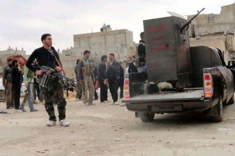 Members of the Free Syrian Army retreated from the Baba Amr district of Homs after Syrian troops, led by the brother of President Bashar Al Assad, launched a ground attack to overrun the neighbourhood.