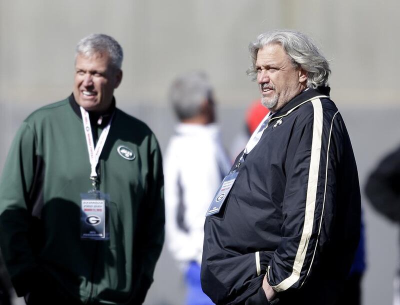 New York Jets head coach Rex Ryan, left, and his brother Rob Ryan, New Orleans Saints defensive coordinator, are following closely in their father's footsteps as successful and outspoken NFL coaches. David Goldman / AP Photo