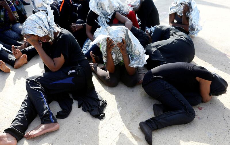 FILE PHOTO: Migrants at a naval base after being rescued by Libyan coast guards in Tripoli, Libya, June 18, 2018.  REUTERS/Ismail Zitouny/File Photo
