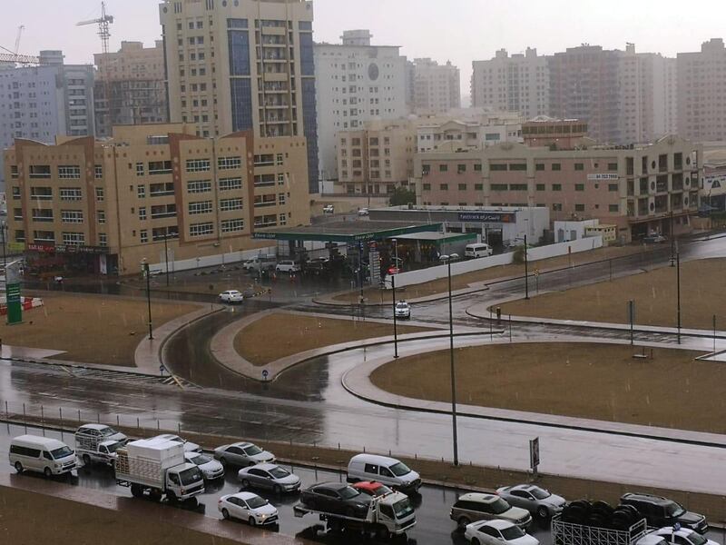 Cars in Dubai negotiate the wet roads. Kumar Shyam / The National