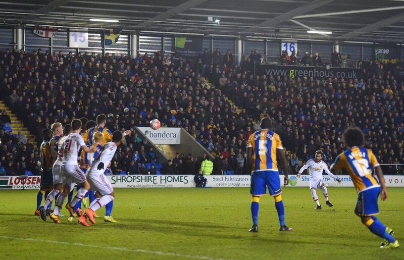 SHREWSBURY, ENGLAND - FEBRUARY 22:  Juan Mata of Manchester United (2R) scores their second goal from a free kick during the Emirates FA Cup fifth round match between Shrewsbury Town and Manchester United at Greenhous Meadow on February 22, 2016 in Shrewsbury, England.  (Photo by Michael Regan/Getty Images)