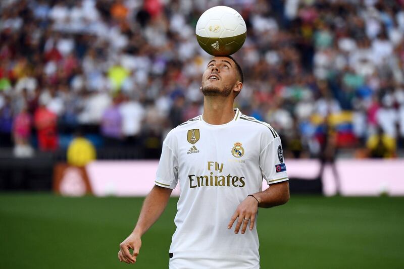 Eden Hazard balances a ball during his unveiling as a Real Madrid player. AFP