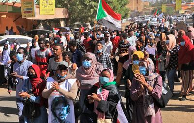 People march in a demonstration in the centre of Sudan's capital Khartoum on November 30, 2021 while protesting against a deal that saw the civilian prime minister reinstated after the military coup in October. AFP