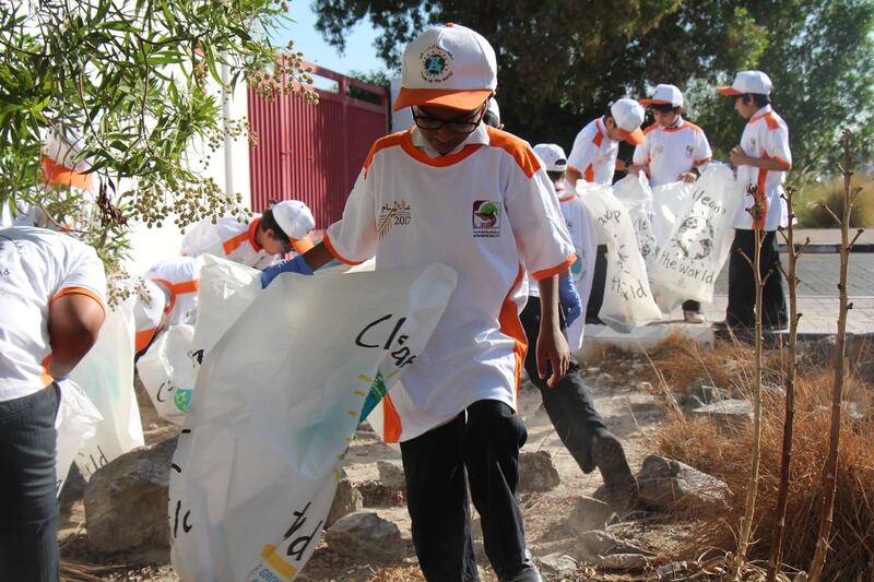 Pupils from Gems Legacy School collecting plastic waste.