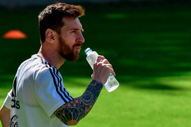 Argentina's Lionel Messi has some water during a training session in Belo Horizonte, state of Minas Gerais, Brazil, on June 18, 2019, on the eve of their Copa America football match against Paraguay. / AFP / Luis ACOSTA