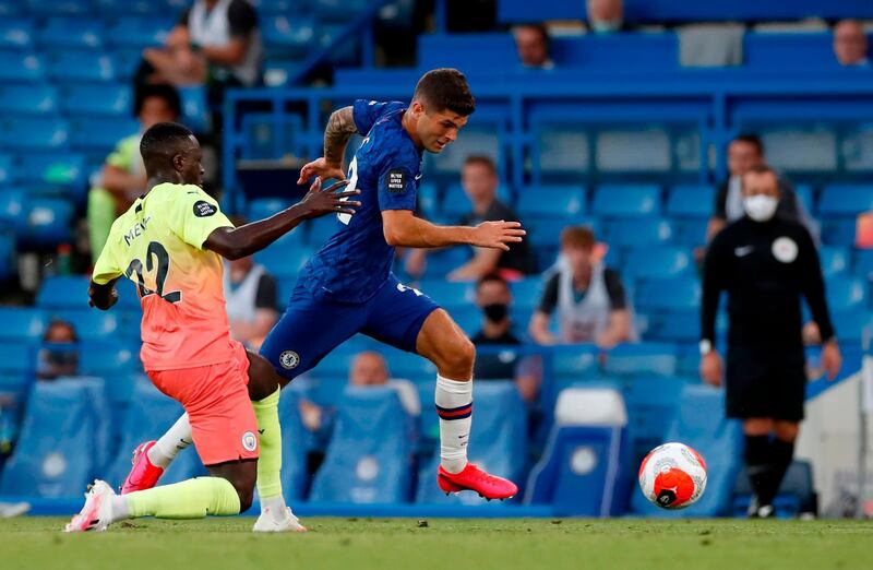 Chelsea's Christian Pulisic skips past the challenge of Manchester City defender Benjamin Mendy to score the opening goal. AFP
