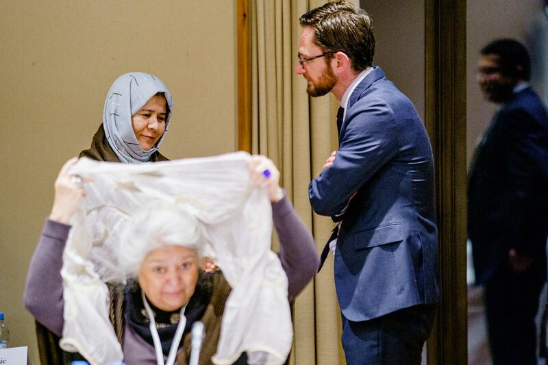 US Special Envoy to Afghanistan Thomas West speaks with Afghan Representative Shah Gul Rezai during a meeting at the Soria Moria hotel in Oslo, Norway. NTB/Stian Lysberg Solum via Reuters