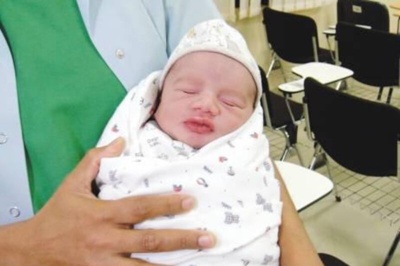 March 23, 2011-photo of a 2 month old baby who was abandoned in UAQ and then transferred to Sharjah social services
Courtesy Al Ittihad  *** Local Caption ***  Sharjah_Office-locals-23-3-2011-12-2.jpg